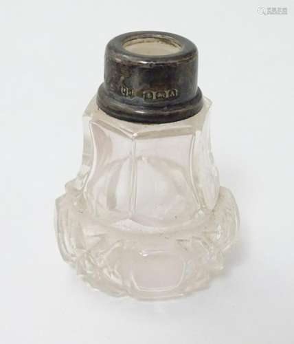 A cut glass scent bottle with silver collar hallmarked