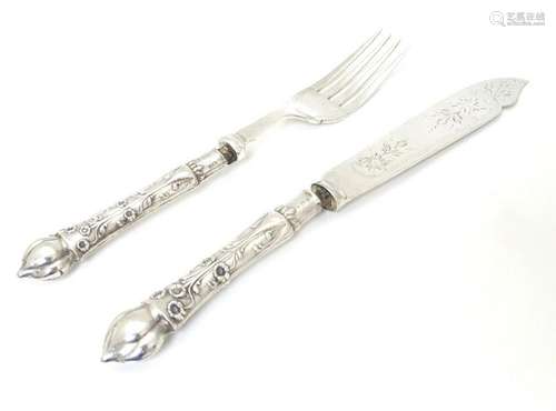 A silver handle fish knife and fork hallmarked