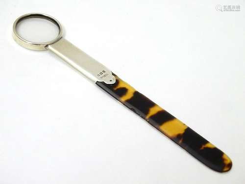 A silver mounted tortoiseshell page turner with