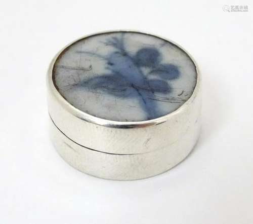 A 925 silver pill box of circular form with inset