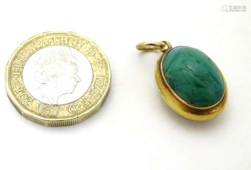 A Victorian gold pendant locket set with malachite
