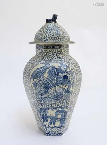 A blue and white hexagonal lidded ginger jar by W. M.
