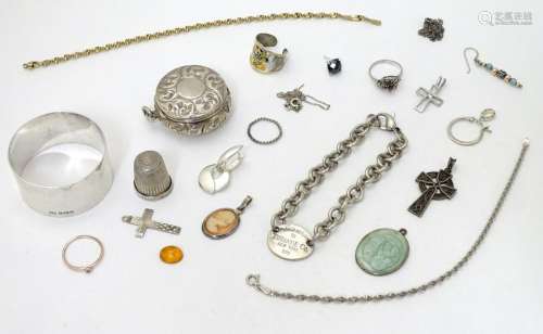 Assorted items including various silver cross pendants,