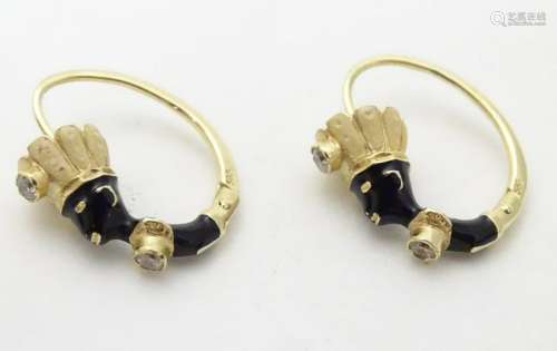 A pair of 14ct gold earrings set with blackamoor figure