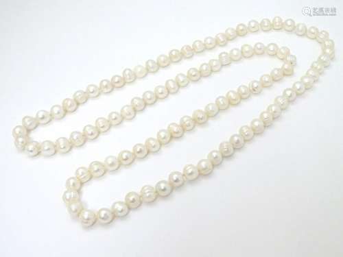 A long pearl necklace approx 44'' long