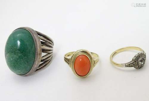 3 rings: a Mid-Century silver ring set with green stone