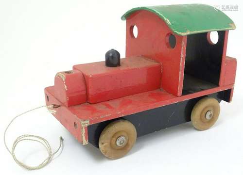 A pull along scratch-built wooden toy train, painted