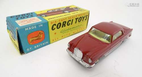 Corgi Toys: A boxed die-cast scale model car,