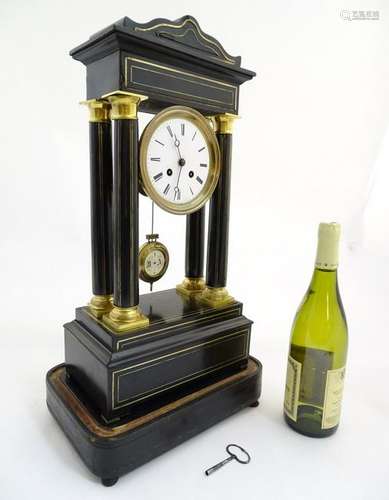 Portico clock  : an 8 day 19thC Ebonised and brass