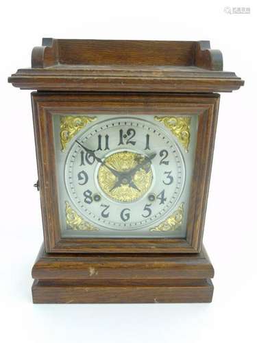 Ansonia Mantel clock : An oak cased 8 day mantle clock