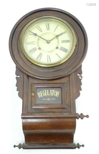 American Regulator wall clock: a walnut cased chisel