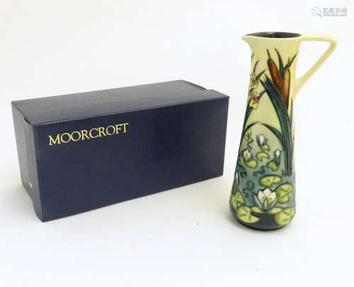 A Moorcroft ewer/jug of tall, tapering form decorated