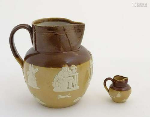 Two Royal Doulton two-tone salt glazed jugs. Decorated