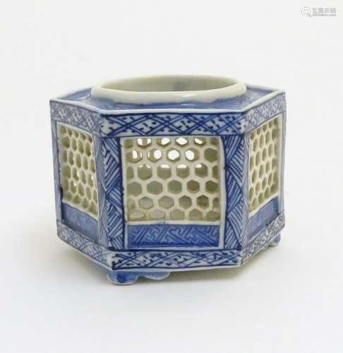 A Chinese blue and white reticulated pot of hexagonal