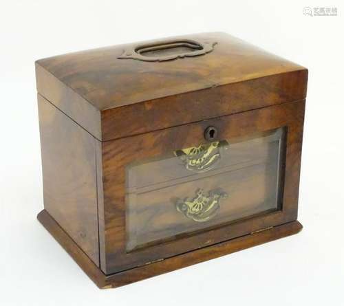 A late 19thC walnut jewellery box with beveled glass