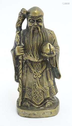 A XX Chinese hollow cast brass figure of Shou, a