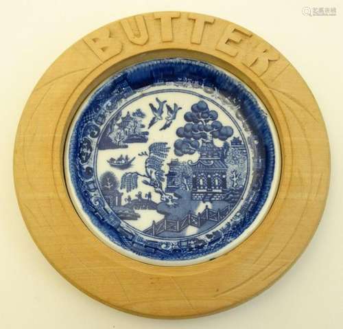 A blue and white ceramic 'Willow' pattern butter dish