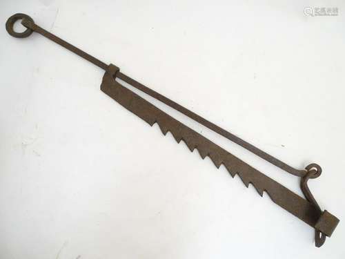 An 18 th / 19thC wrought iron pot hanger of adjustable