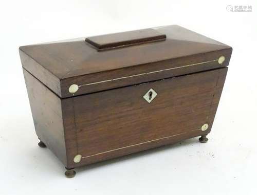 An early 19thC inlaid rosewood sarcophagus tea caddy