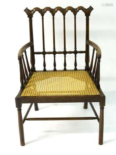 A 19thC mahogany open armchair with a repeating carved