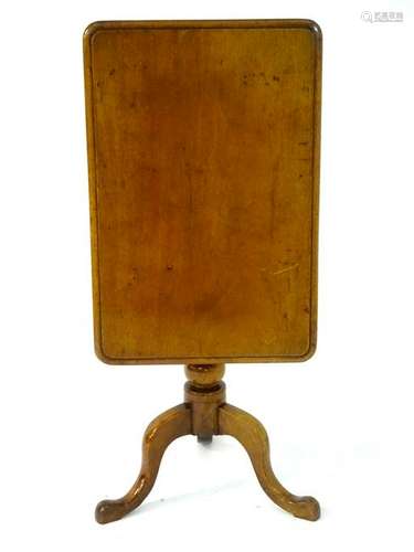 An early 19thC mahogany tilt top table with a