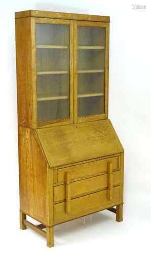 An early / mid 20thC oak bureau bookcase, the top