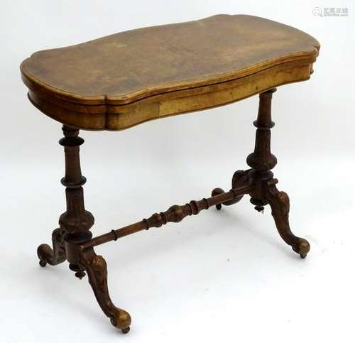 A late 19thC burr walnut card table with two turned