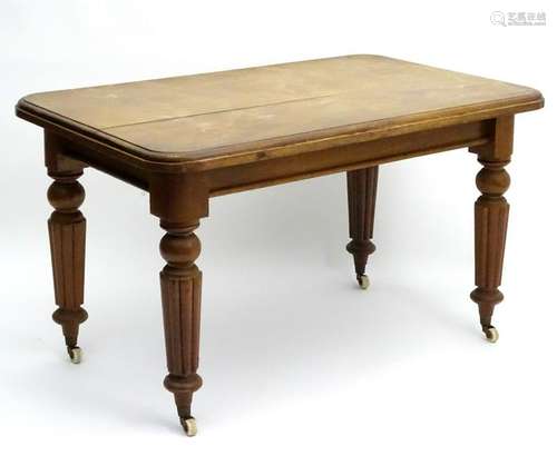 A Victorian mahogany table with a rectangular moulded