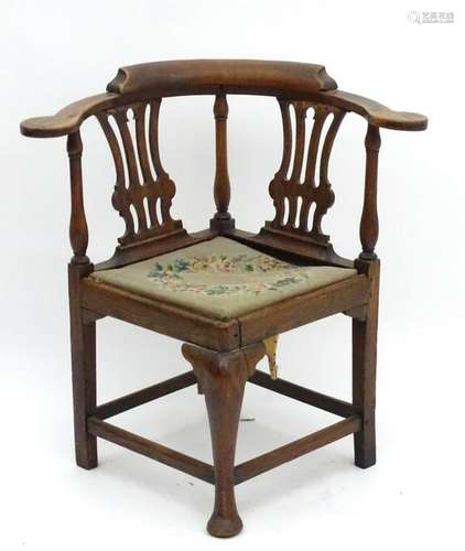 A late Georgian corner chair with turned supports,