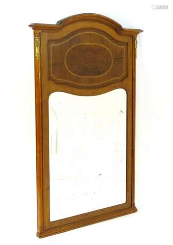 An early 20thC mahogany over mantle mirror with ormolu