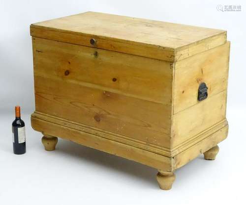 A late 19thC pine cellarette with a double lifting lid