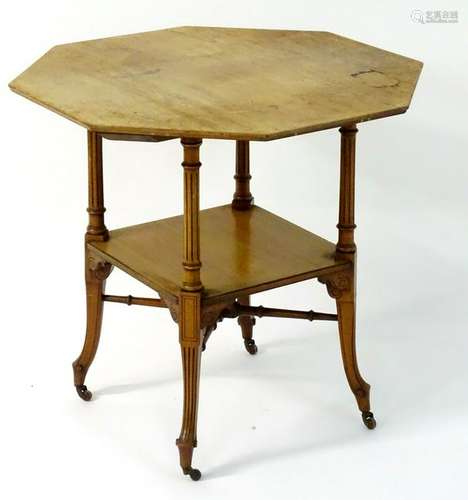 A late 19thC walnut octagonal table with fluted