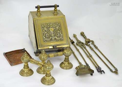 An assortment of Victorian and later brass fire tools,