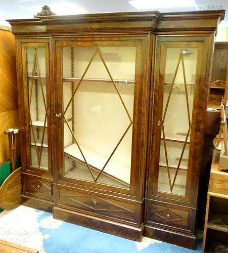 A mid 20thC mahogany break front bookcase /