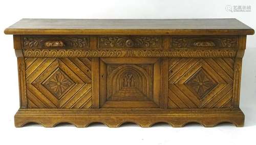 A mid / late 20thC oak sideboard with three short