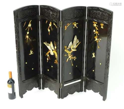 A mid 20thC four fold Japanese screen decorated with