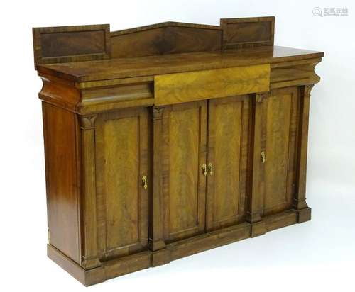 A Victorian mahogany sideboard with a painted up stand