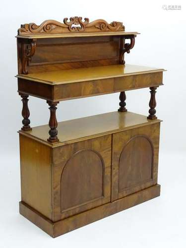 A late Victorian mahogany buffet, over three tiers with