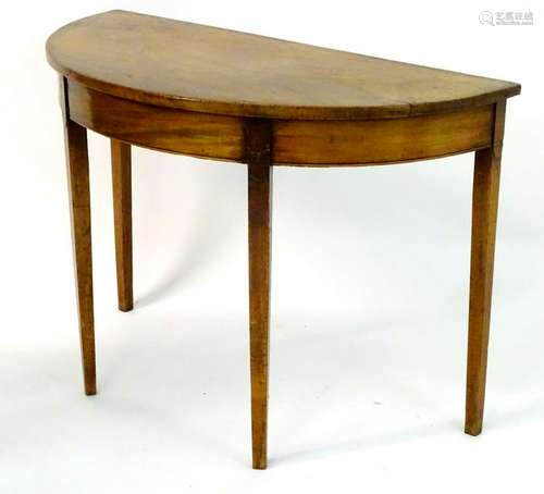 An early / mid 19thC mahogany demi lune table with