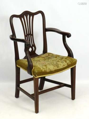A late 19thC mahogany open armchair / desk chair with