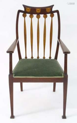 An Arts & Crafts mahogany open armchair with marquetry