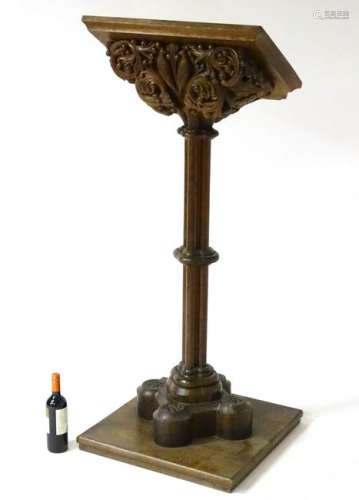 A 19thC oak lectern, the top profusely  carved