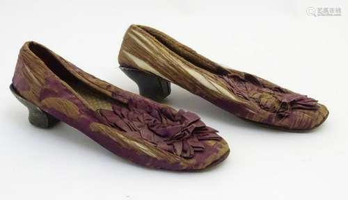 A pair of ladies silk shoes c1860, with rosette detail