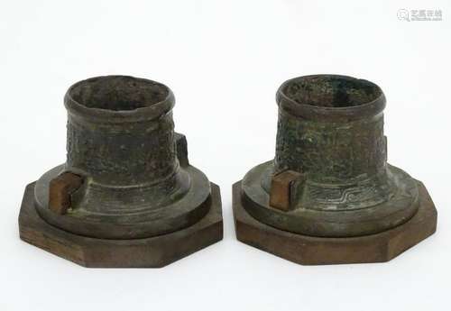 A pair of oriental cast inkwell stands? now with an