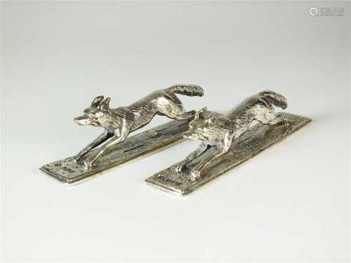 A pair of Victorian silver 'fox' knife rests