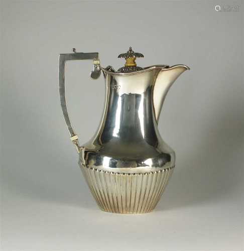 A silver hot water jug