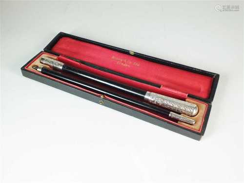 An early 20th century cased silver mounted conductors baton