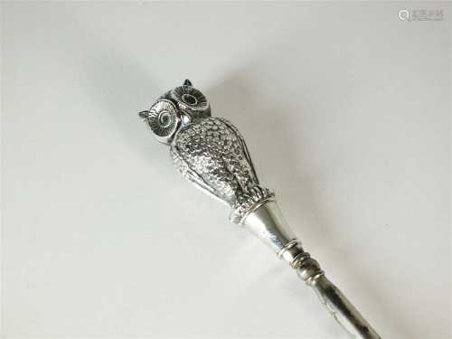 An Edwardian silver mounted owl button hook