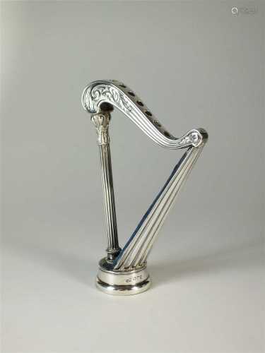 An Edwardian novelty silver harp hat pin holder