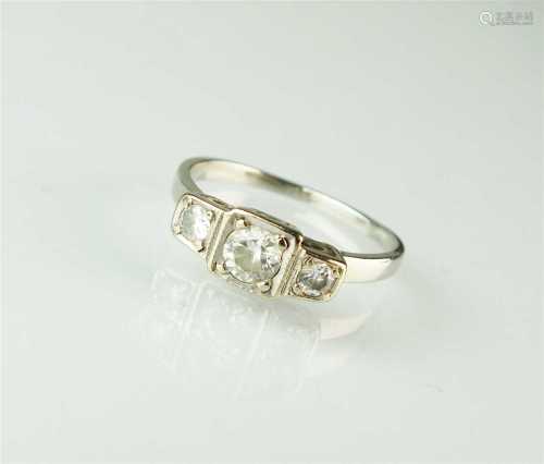 An Art Deco three stone diamond ring